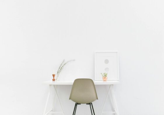 beige and black chair in front of white desk